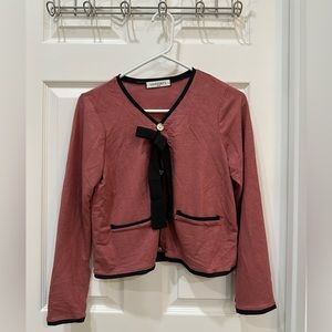 Pink long sleeve princess top with black tie and gold buttons in women’s size S